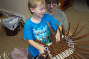 Asher - "Oma, you hold it while I weave."